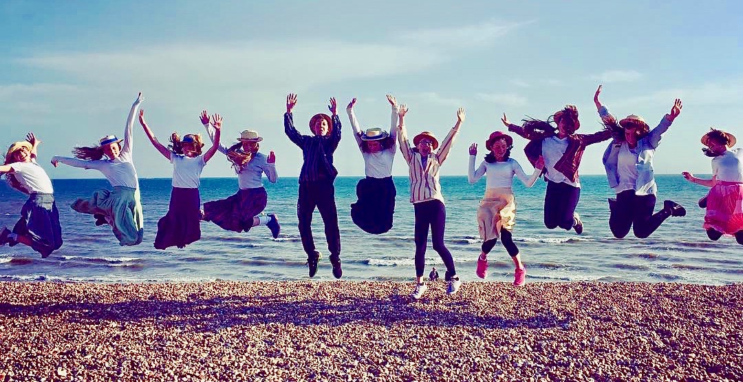 Teenagers jumping on beach